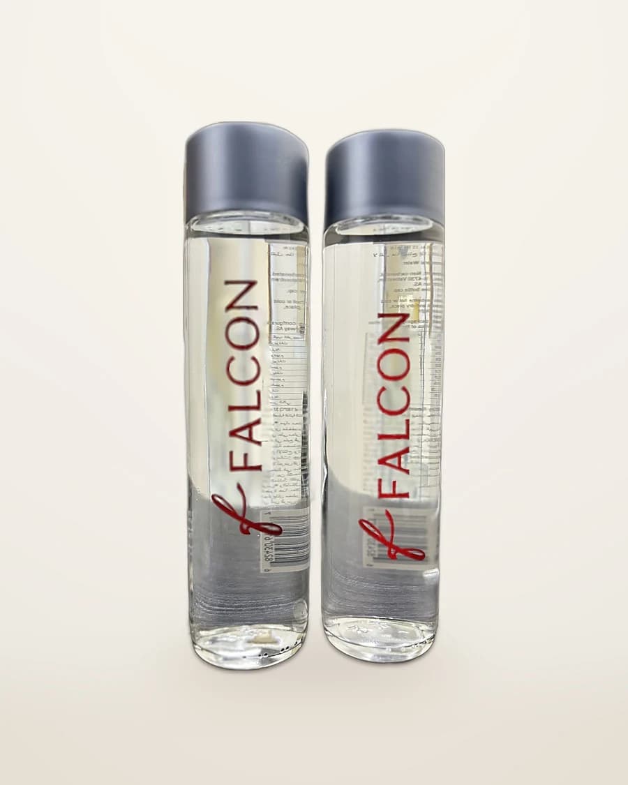 Two clear glass water bottles with grey caps, printed with the red Falcon logo