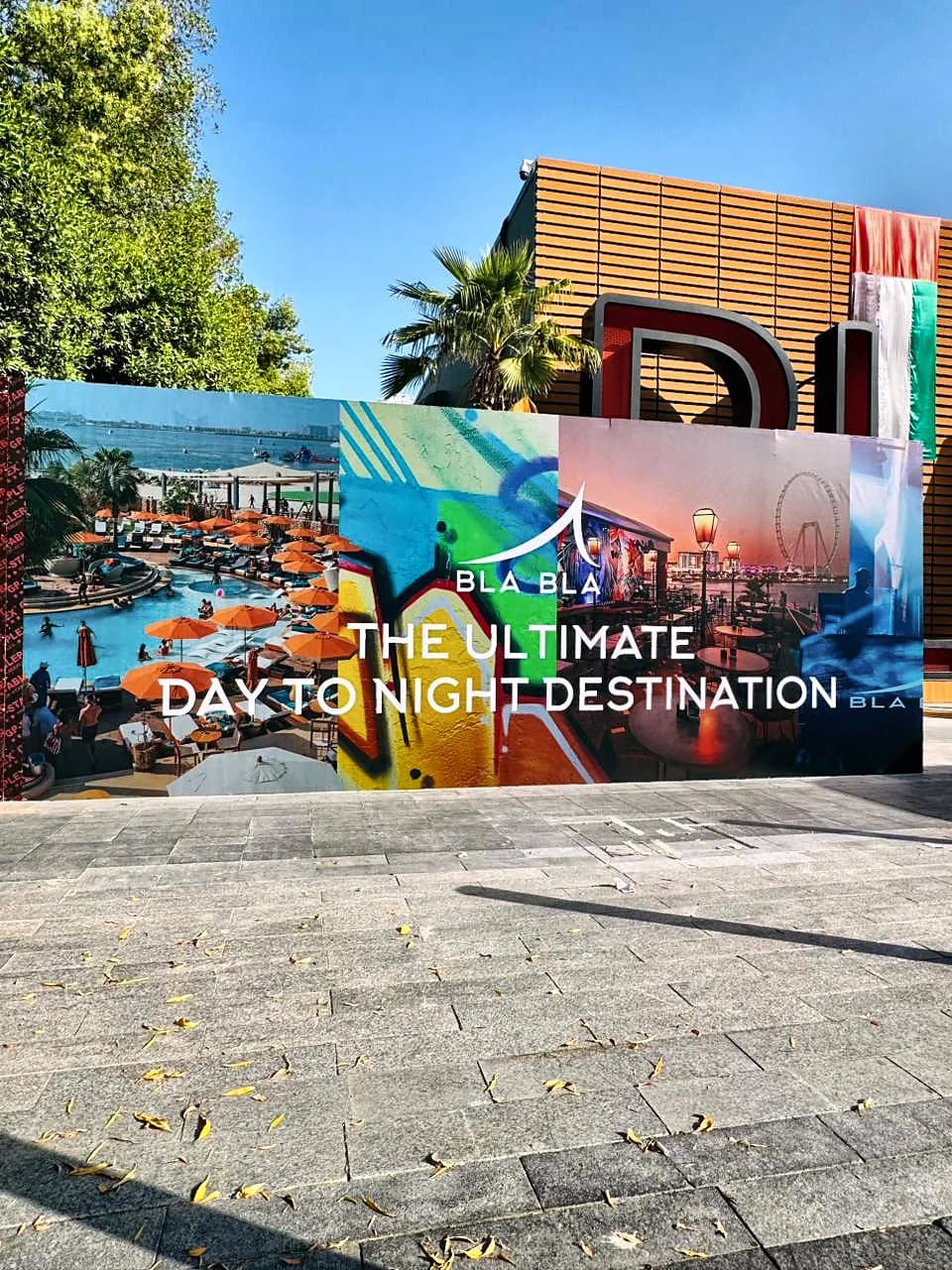 Outdoor hoarding printed with pool, graffiti and evening scenes and the Bla Bla line The ultimate day to night destination